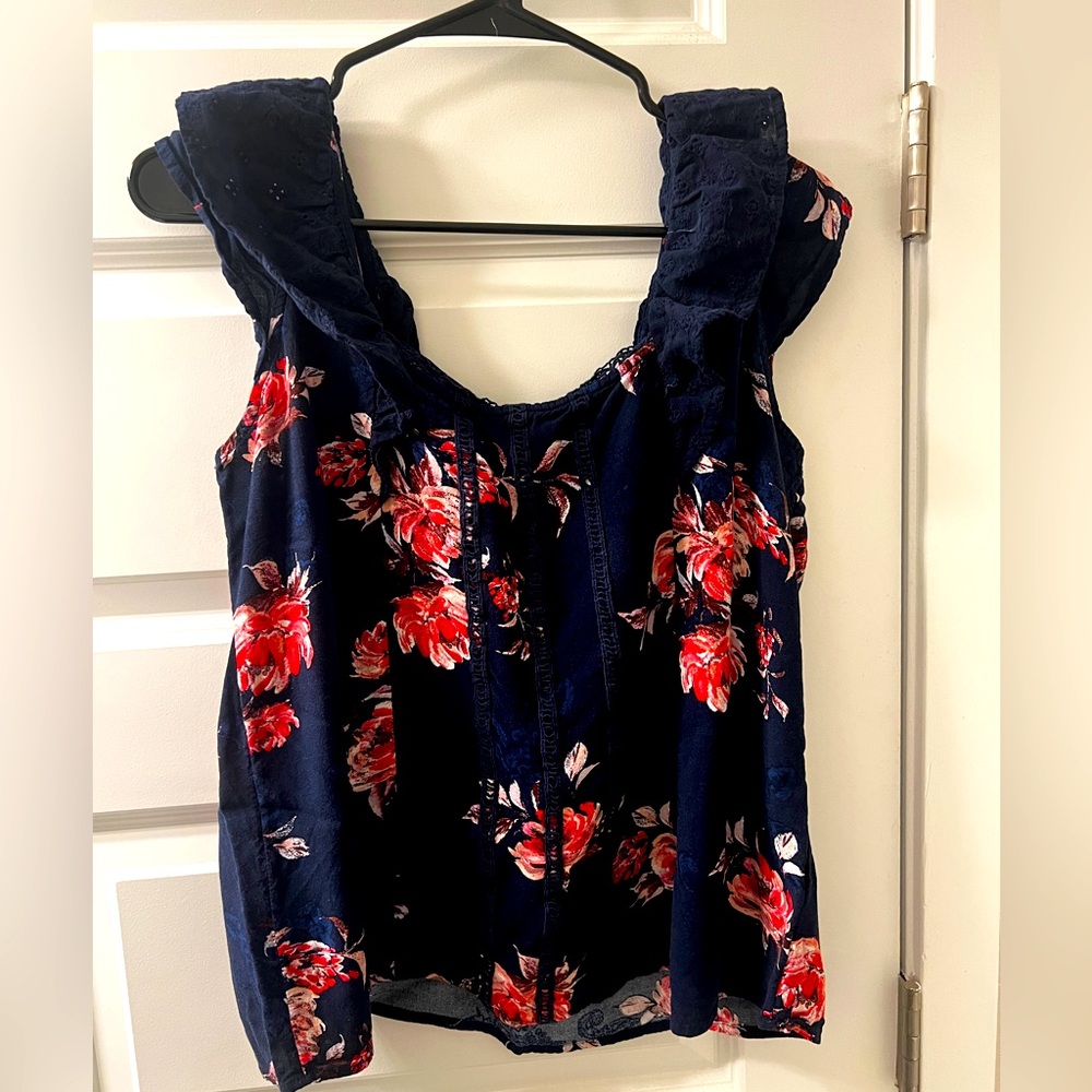 Maurice’s flower tank top with flutter detail.